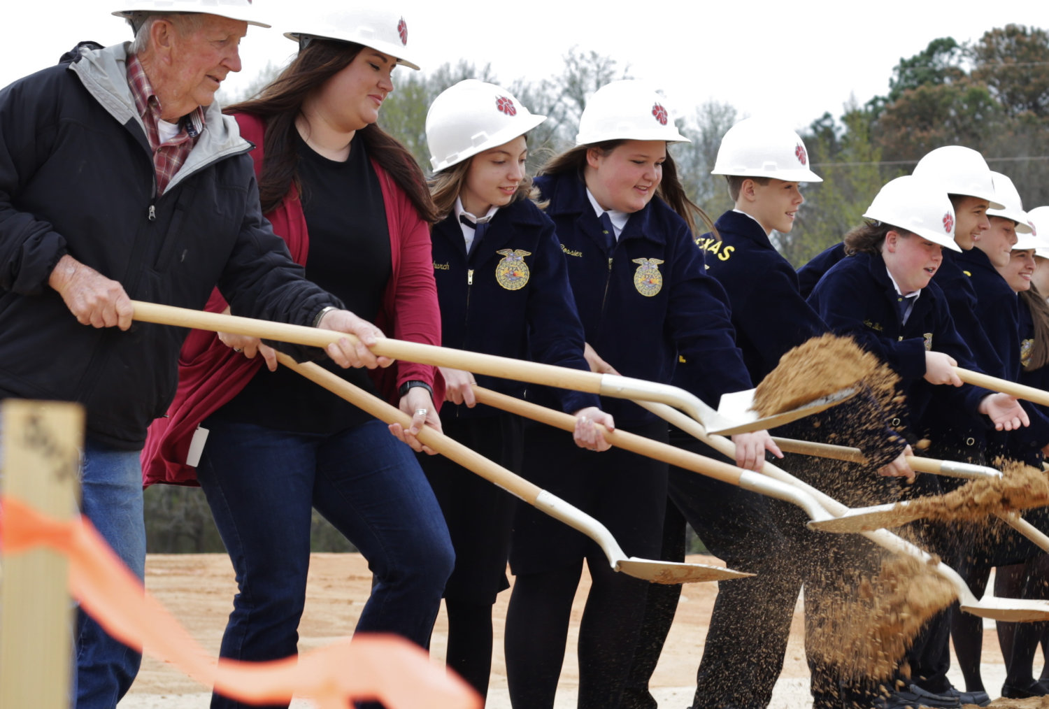 Dirt flies as Alba-Golden students and staff participate in the groundbreaking of the new Agricultural Project Facility on Monday.
